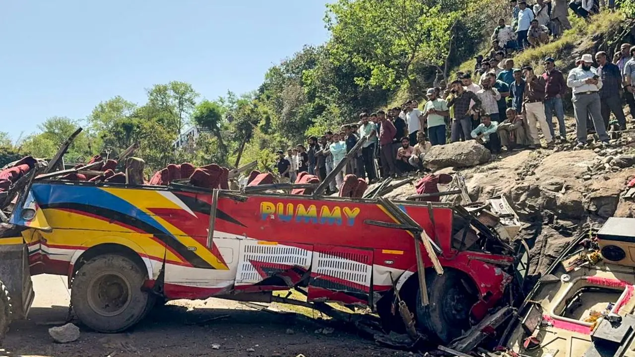 Wrecked remains of a passenger bus after it rolled down a hill in Jammu and Kashmir. Pic/PTI